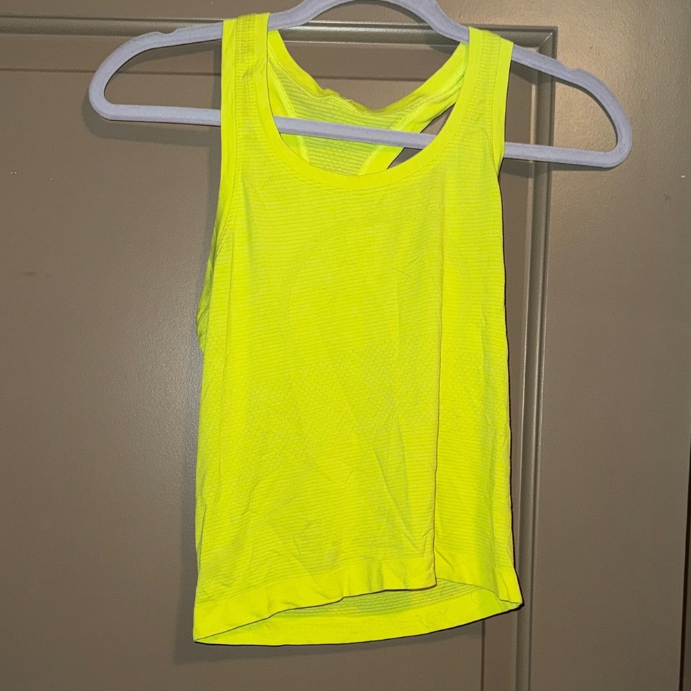 Women’s bright yellow lululemon swiftly tank, waist length